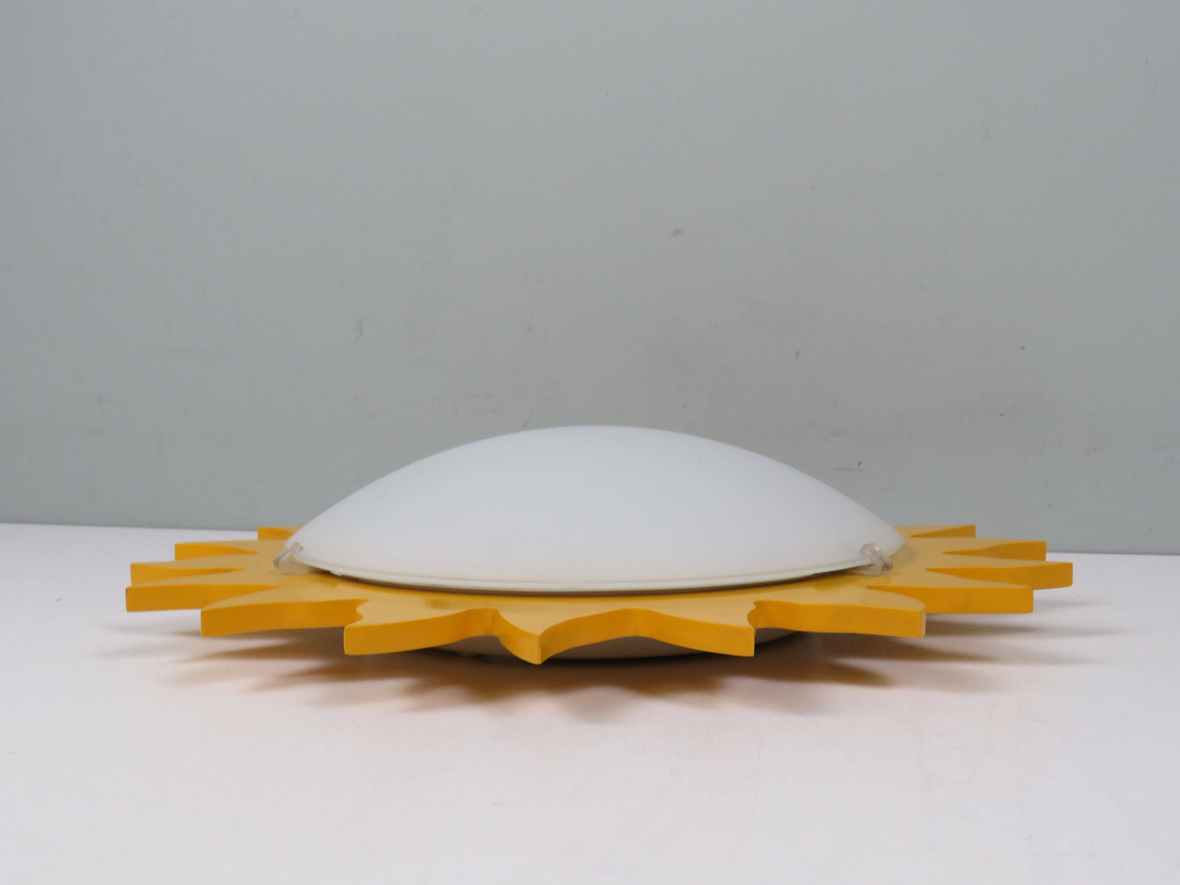 Vintage "sun" ceiling light Massive Belgium in opaline glass and lacquered wood.
