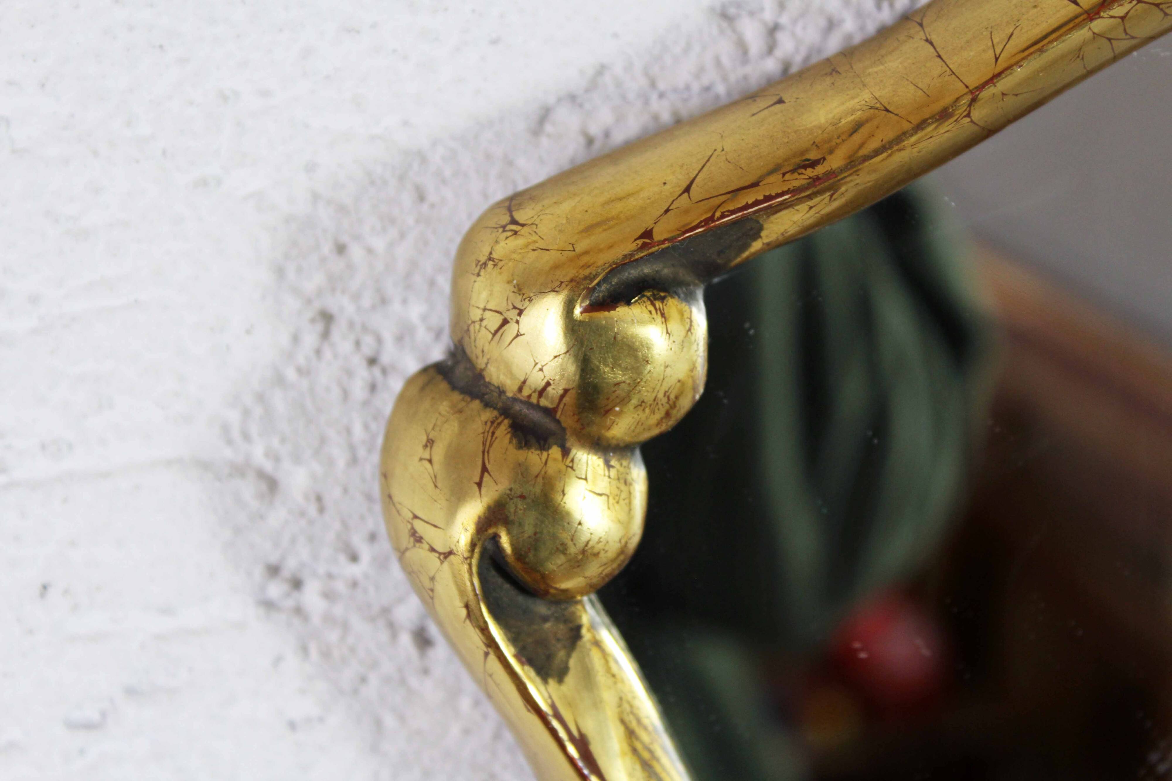 Mirror in gilded wood with leaf