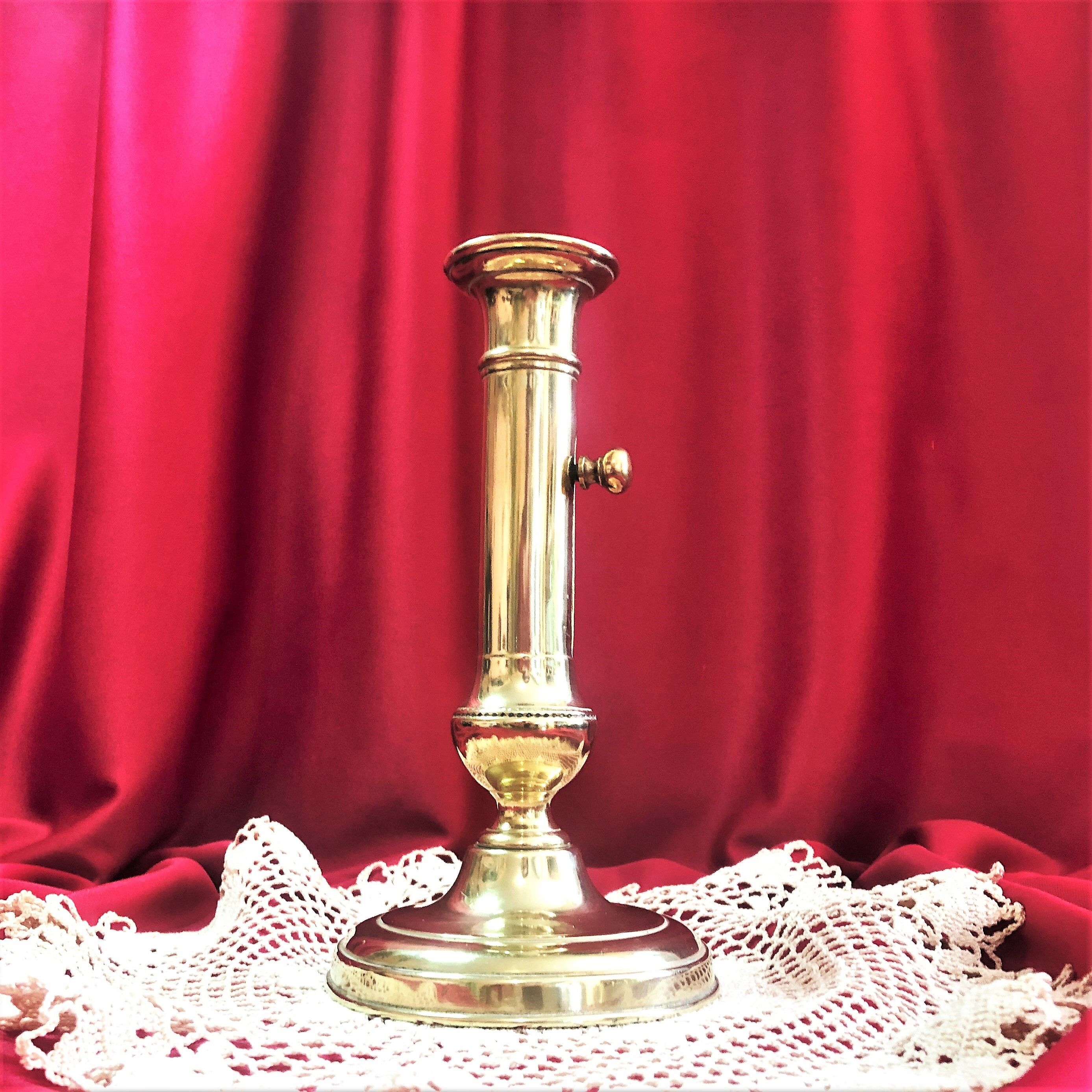 Gilded copper push candle holder