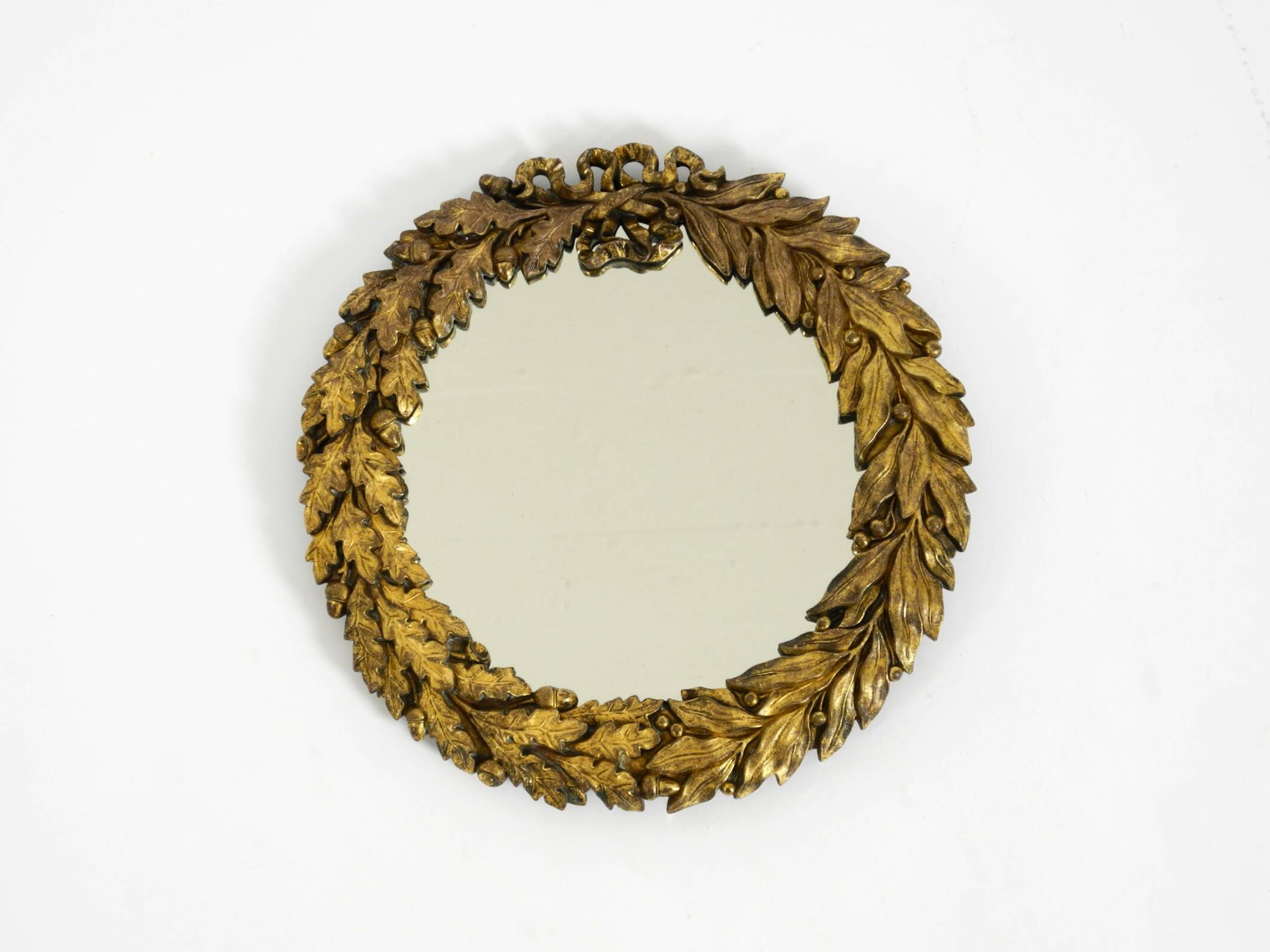 Beautiful small French mid-century wall mirror with an ornate brass frame