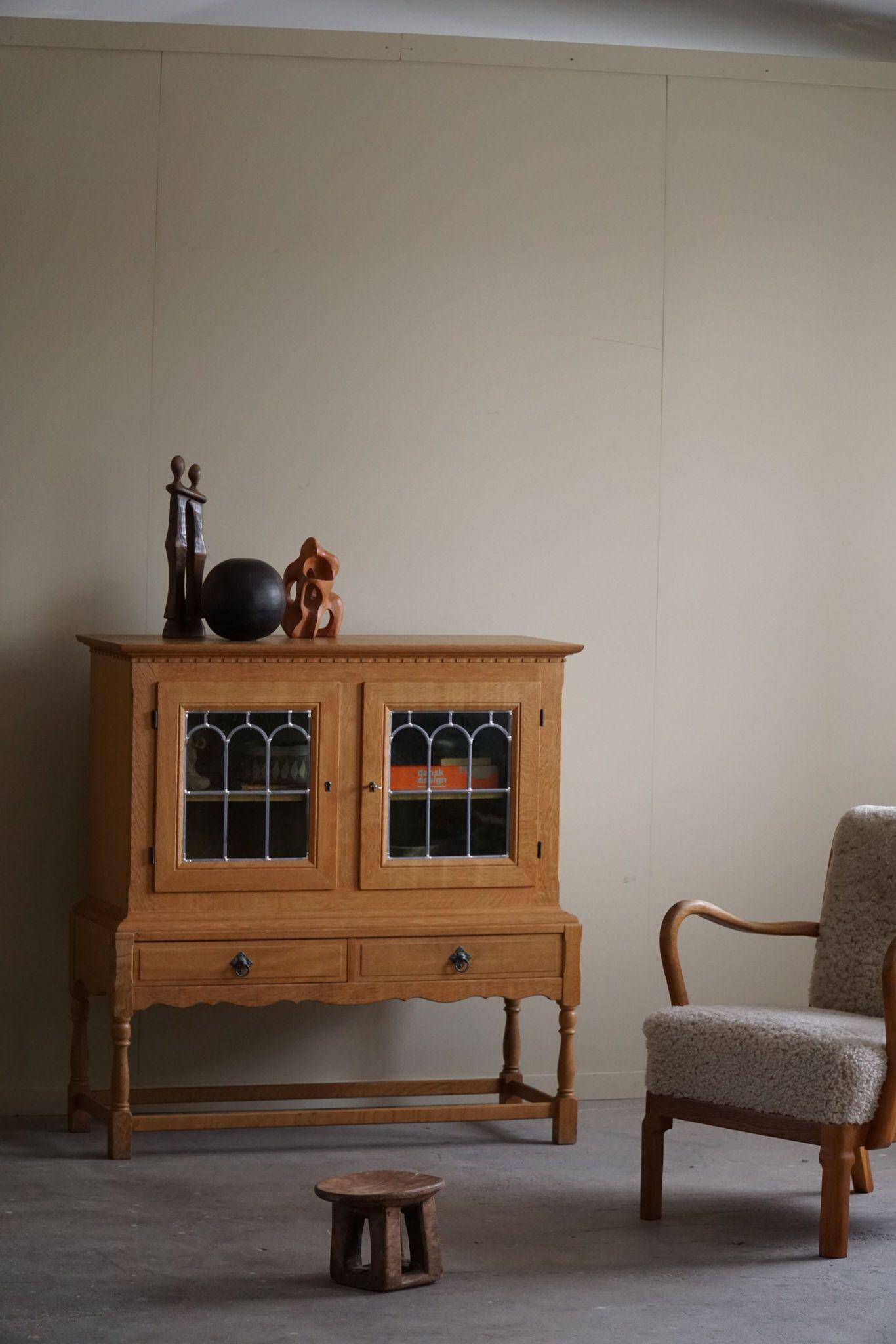 20th-century solid oak display cabinet with a glass front, by a Danish cabinetmaker.