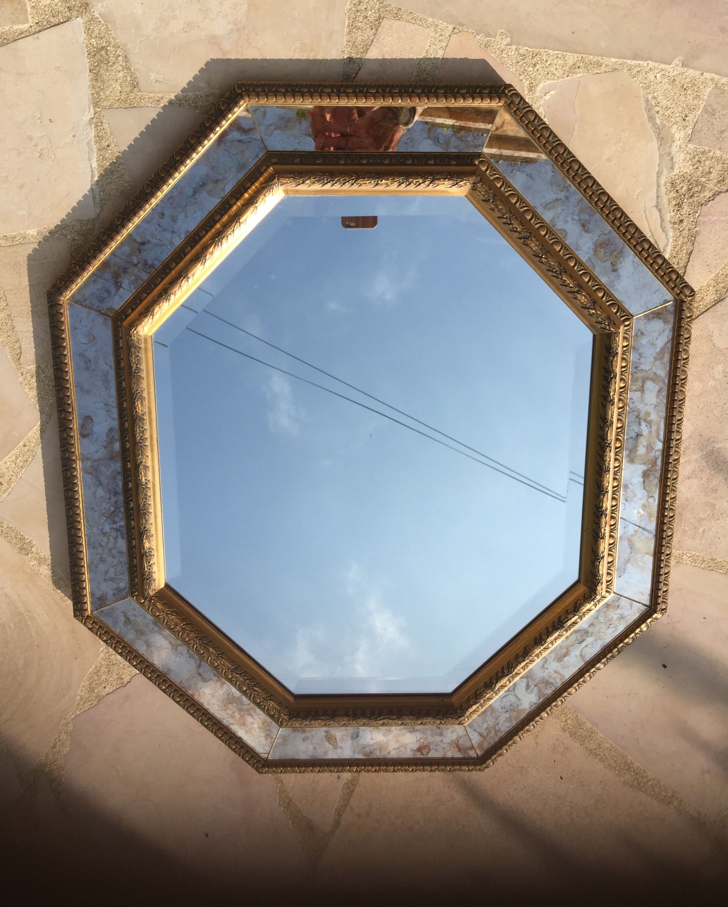 Antique mirror in gilded wood with beveled octagonal shape 72 x 63 cm