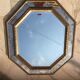 Antique mirror in gilded wood with beveled octagonal shape 72 x 63 cm