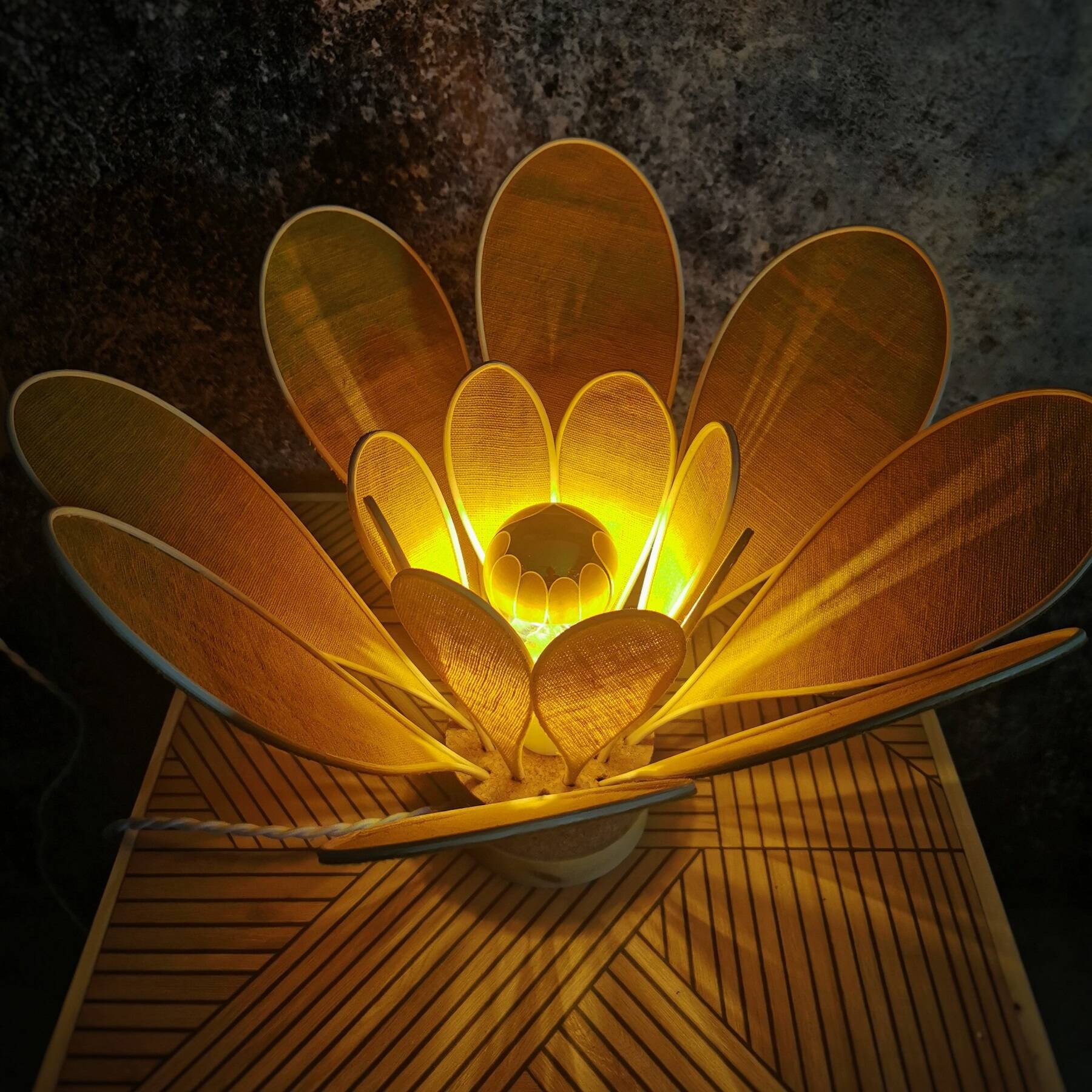 Flower table lamp made of rattan and saffron yellow linen petals