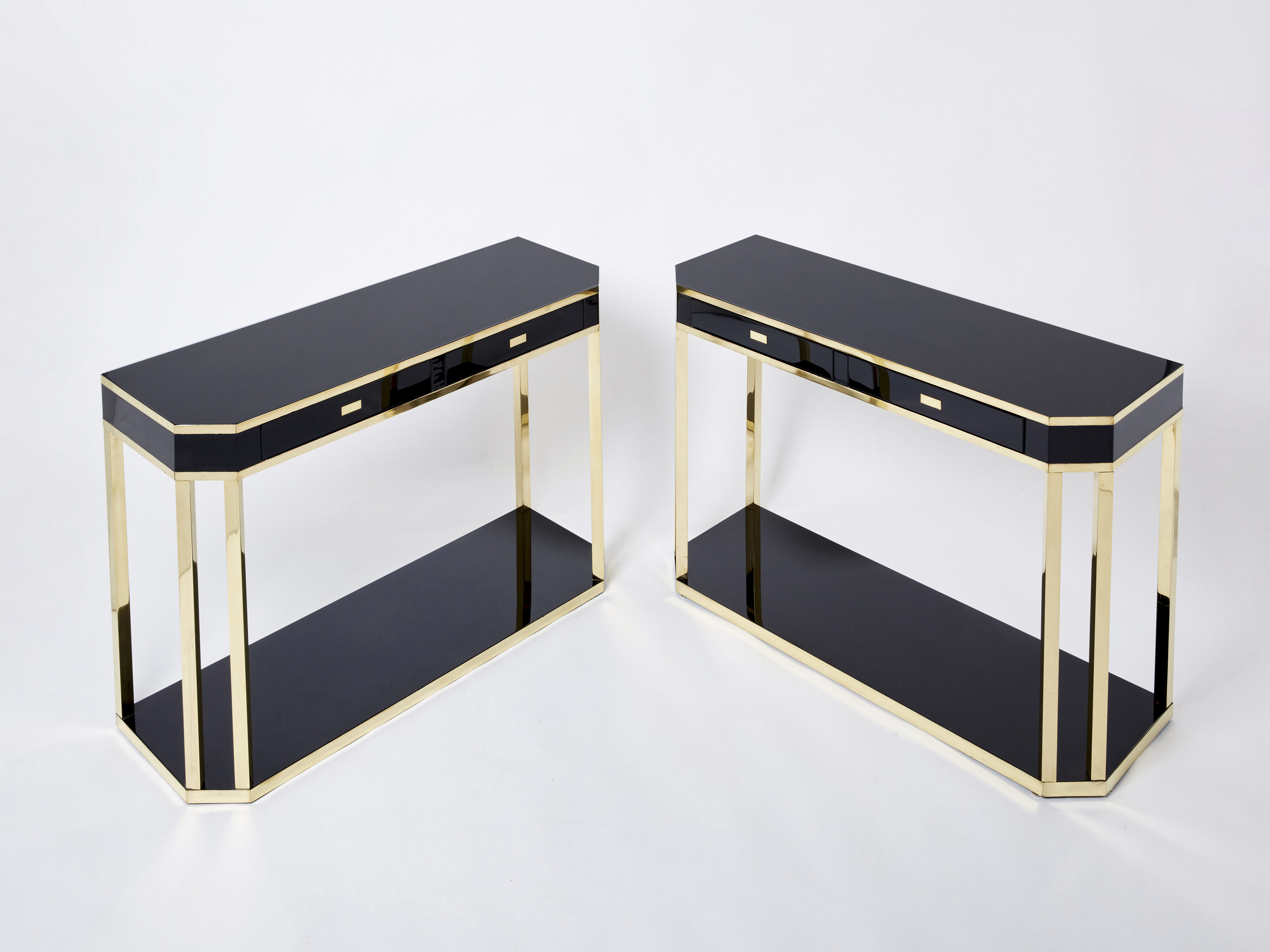 Pair of black lacquered consoles and brass 1970