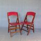2 chaises pliantes, de secours, assises skaï rouge