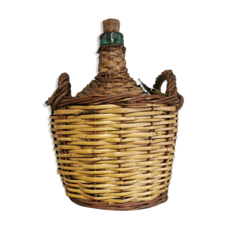 Old demijohn with wicker
