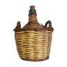 Old demijohn with wicker