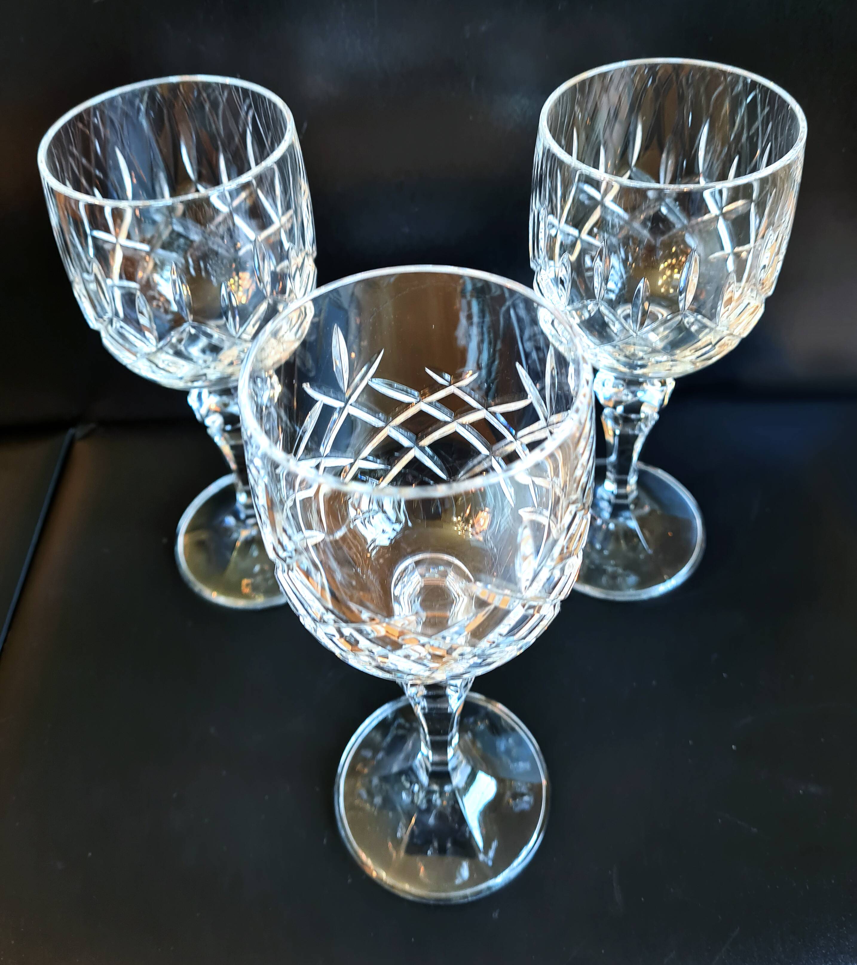 Set of three cut Bohemian Crystal Stemmed Glasses.