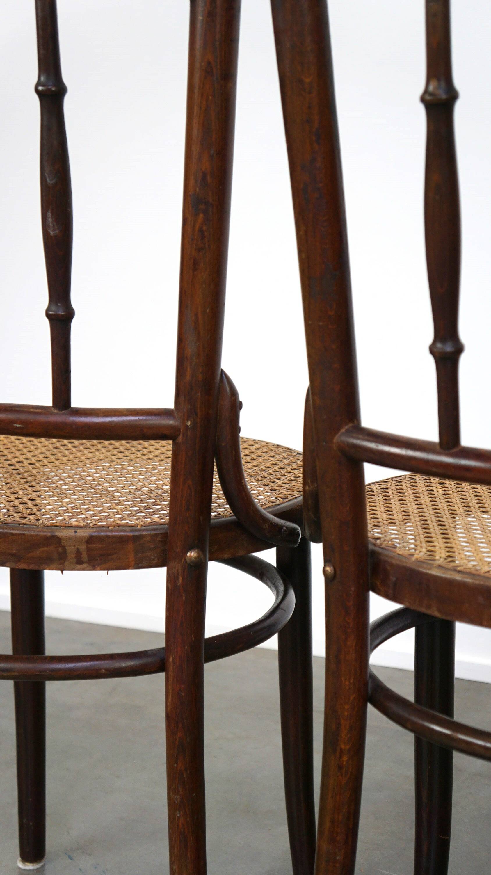 4 antique wooden and cane bistro chairs