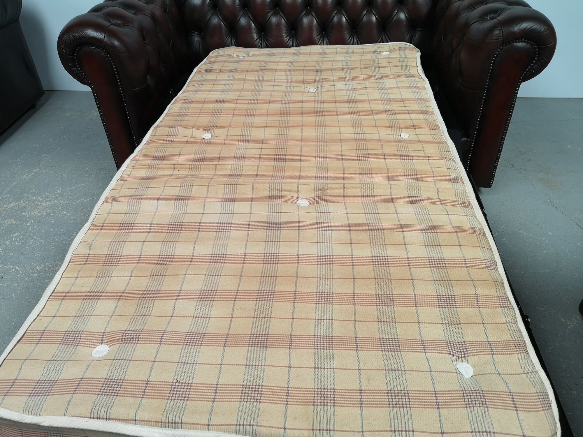 Convertible leather chesterfield sofa