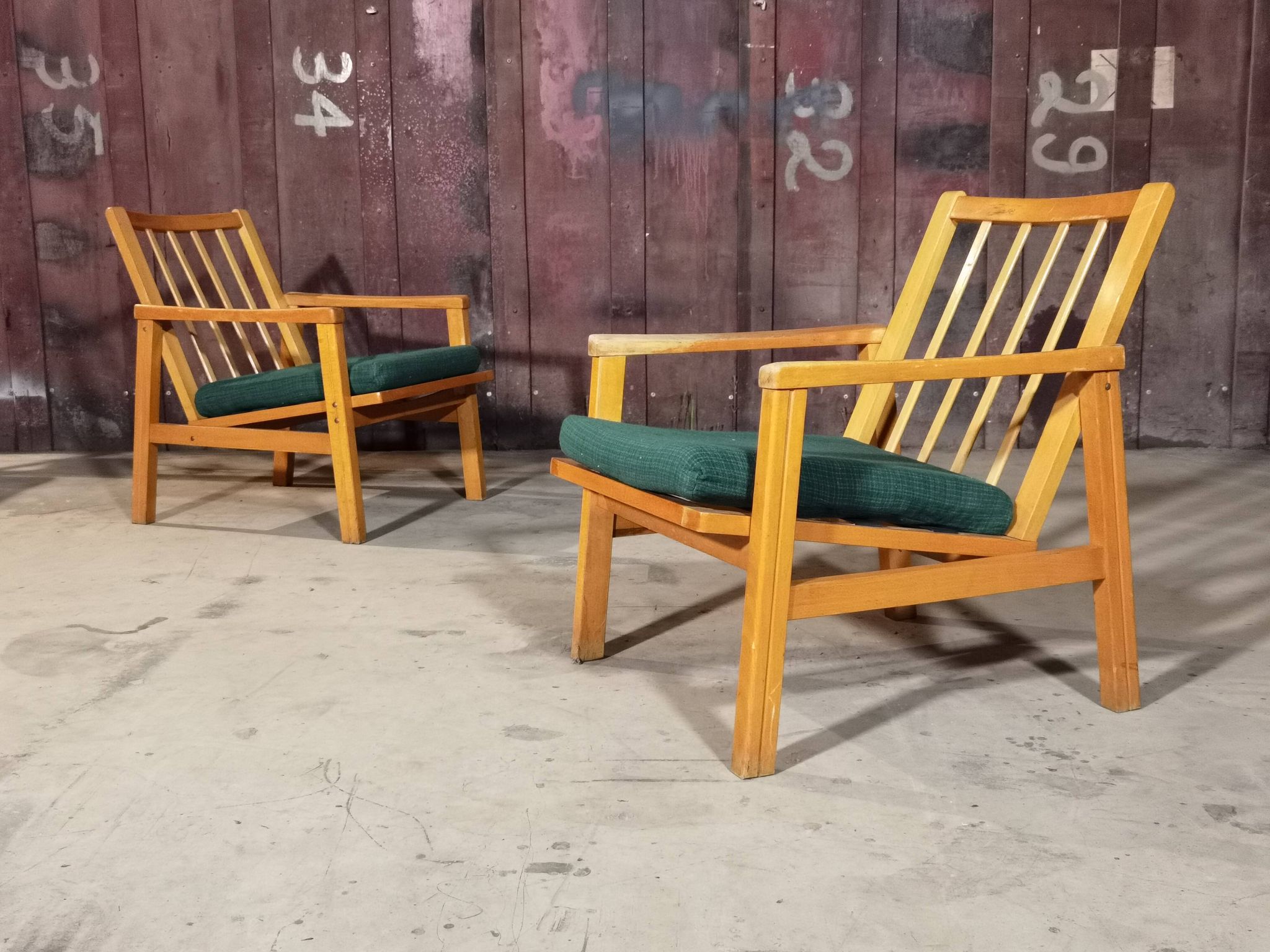 Pair of dark green armchairs