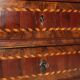 Antique drop-leaf cabinet in various types of wood, Italy, 18th century.