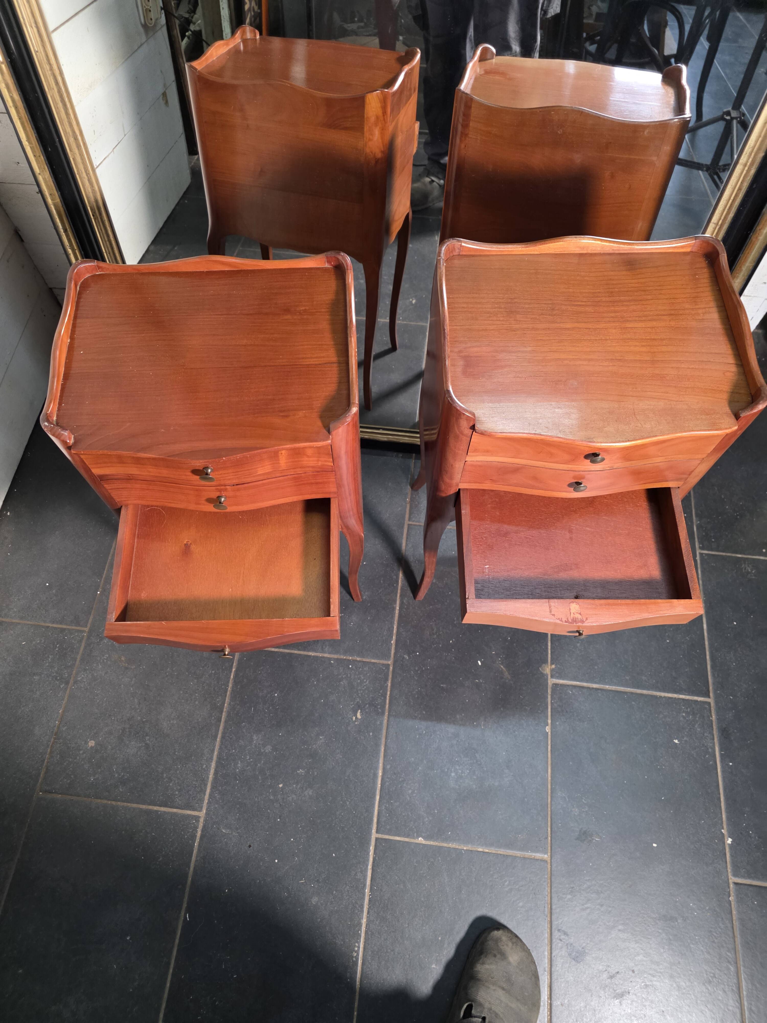 Pair of Louis XV style bedside tables in cherry wood.