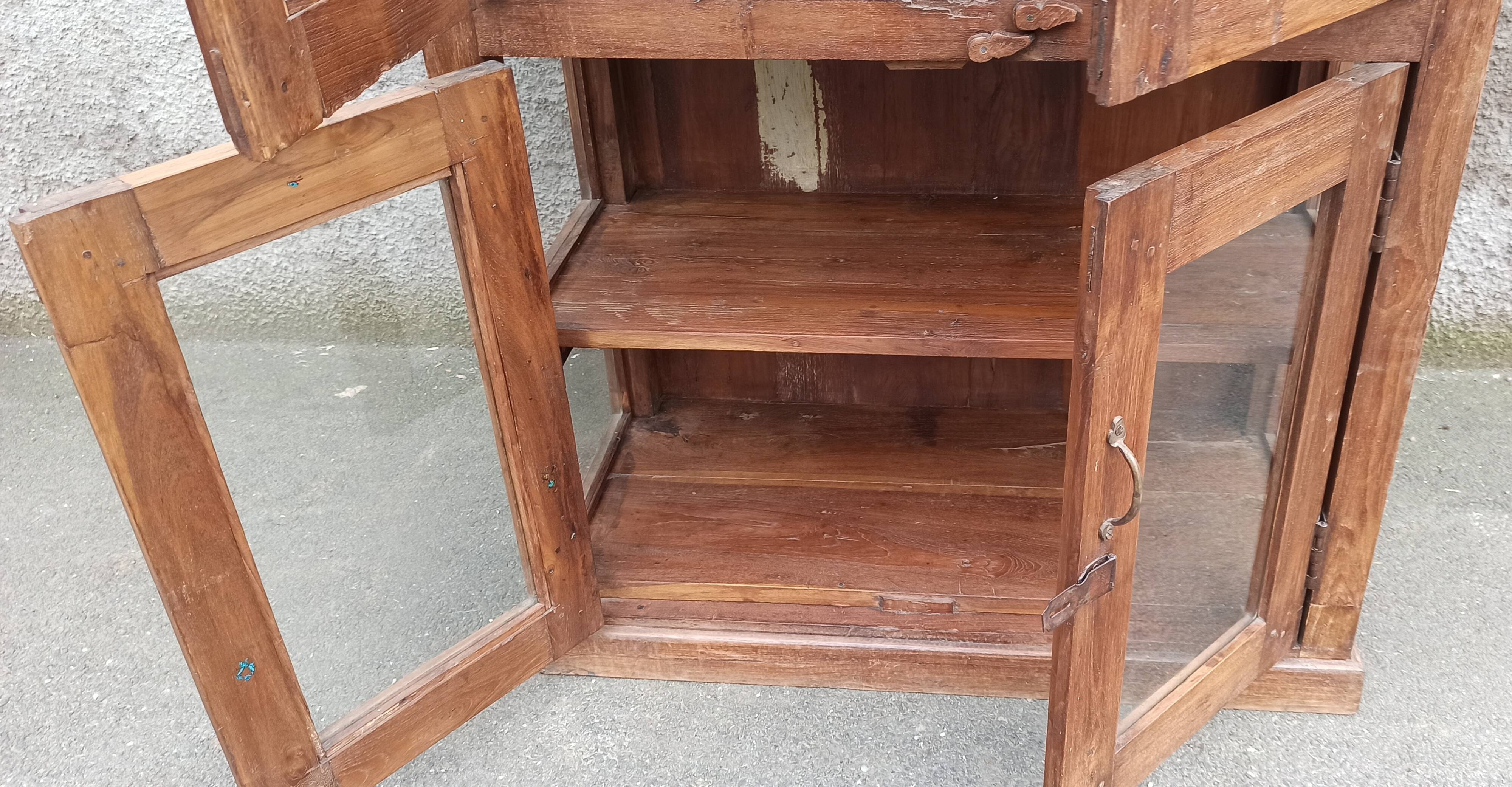 Old wooden display cabinet with three glazed sides