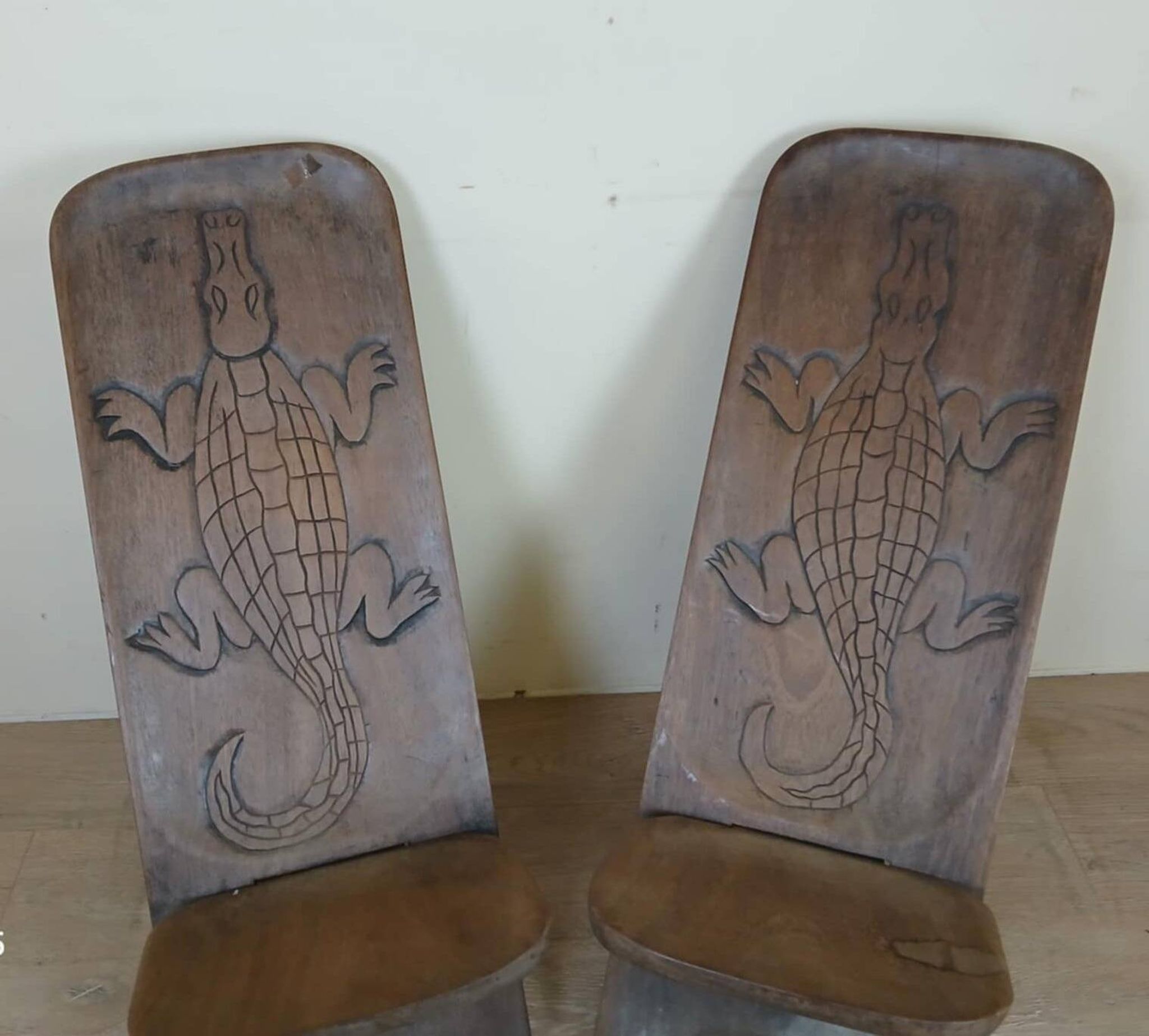 Central Africa circa 1950: pair of exotic wood chairs decorated with crocodile sculptures