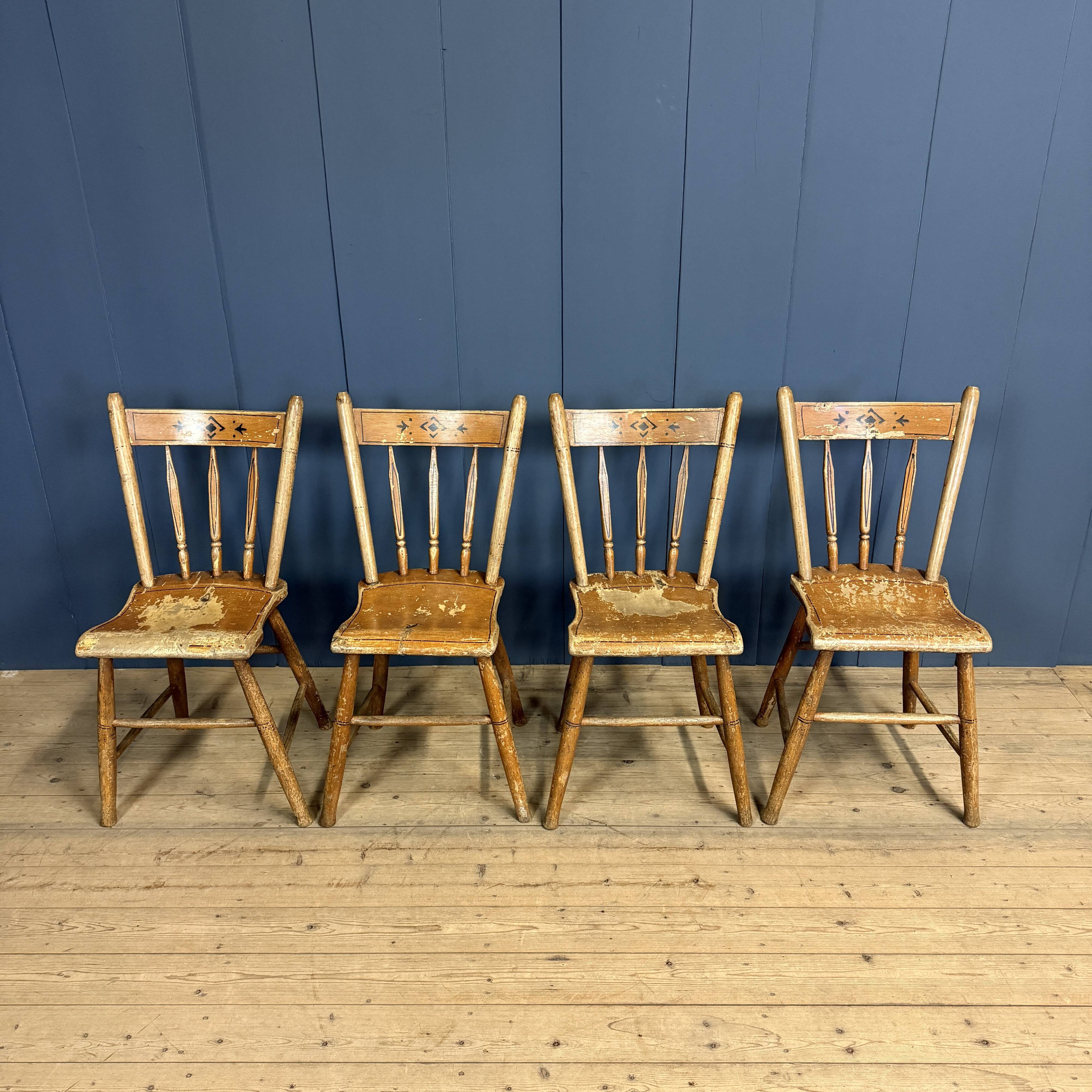 Set of four painted Dutch kitchen chairs.