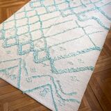 Berber cream carpet with blue pattern