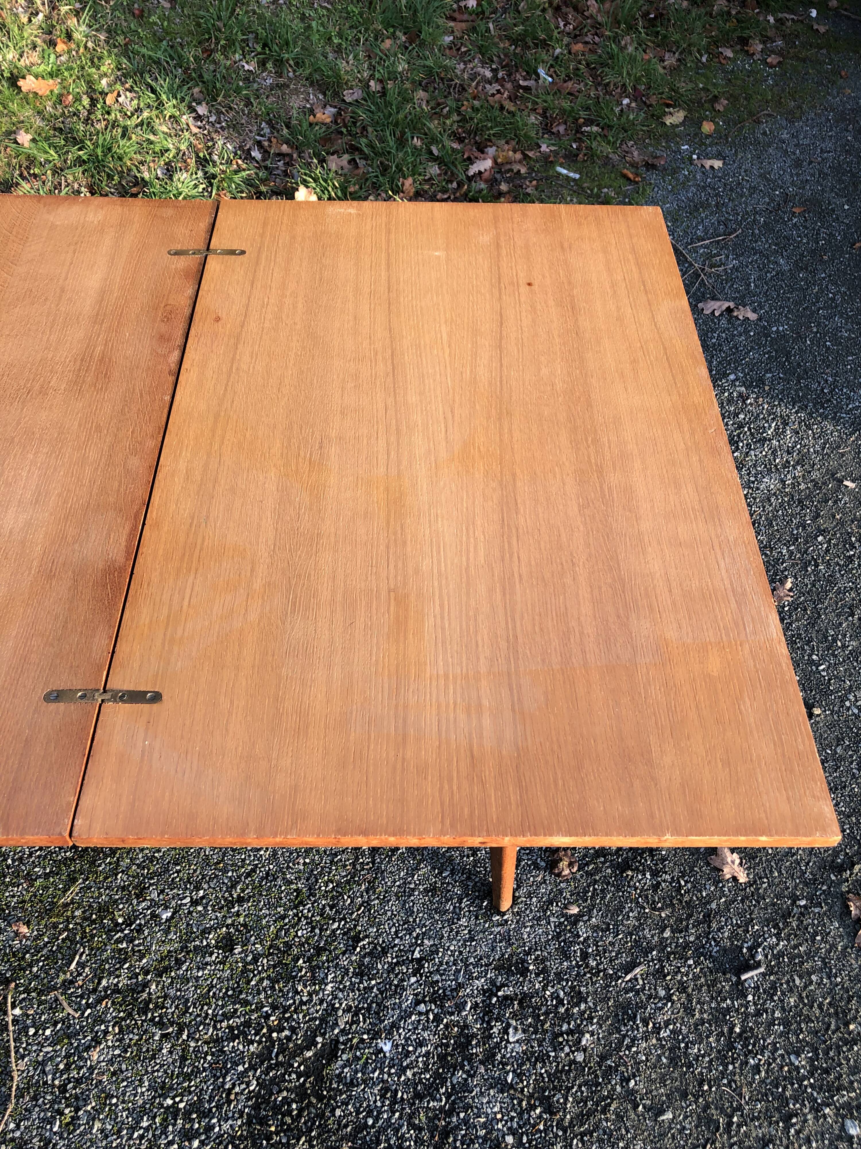 Vintage so-called portfolio table with oak compass base and its oak cp swivel top.