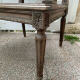 Wooden armchair with caning in Louis XVI style