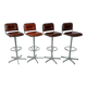 1970s chrome bar stools with cognac-colored faux leather upholstery