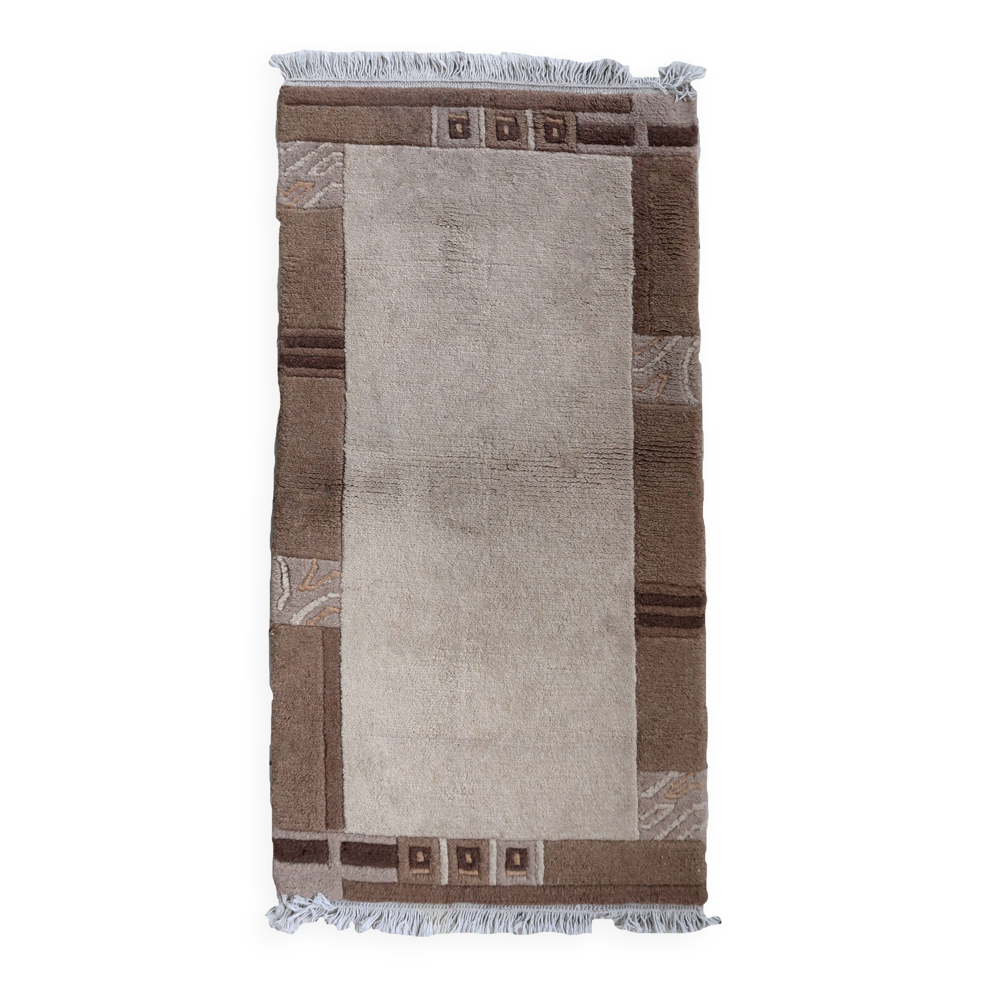 Tapis vintage tibétain Khaden fait main en laine – 64 x 124 cm  Années 1970