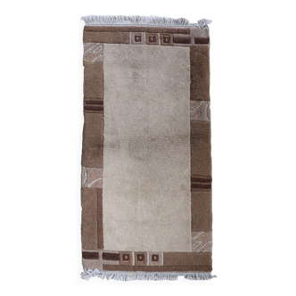 Tapis vintage tibétain Khaden fait main en laine – 64 x 124 cm  Années 1970