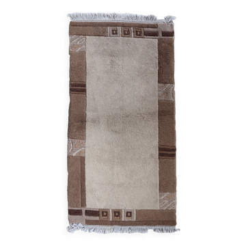 Tapis vintage tibétain Khaden fait main en laine – 64 x 124 cm Années 1970