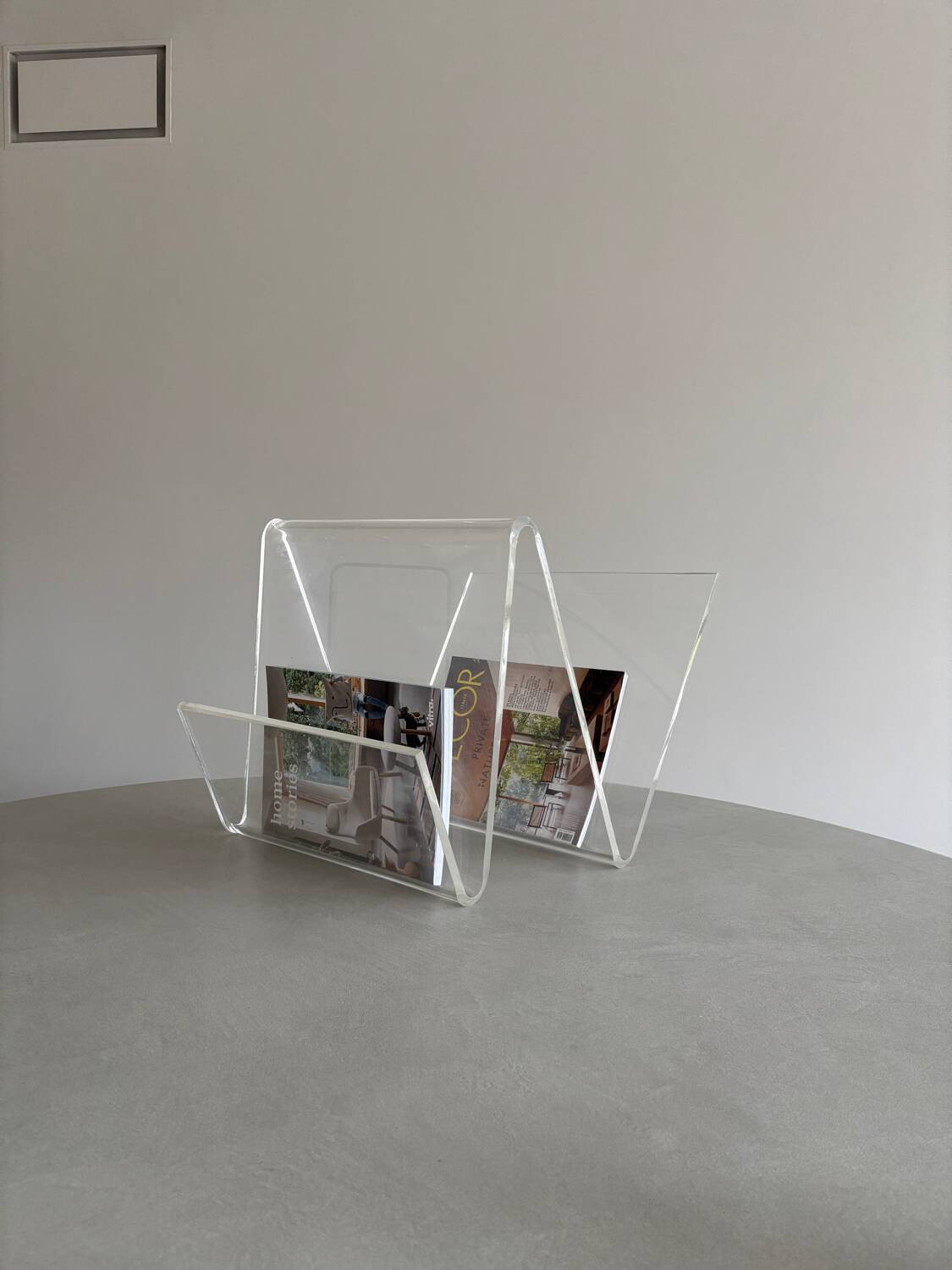 Asymmetrical design magazine rack in transparent acrylic, 70s