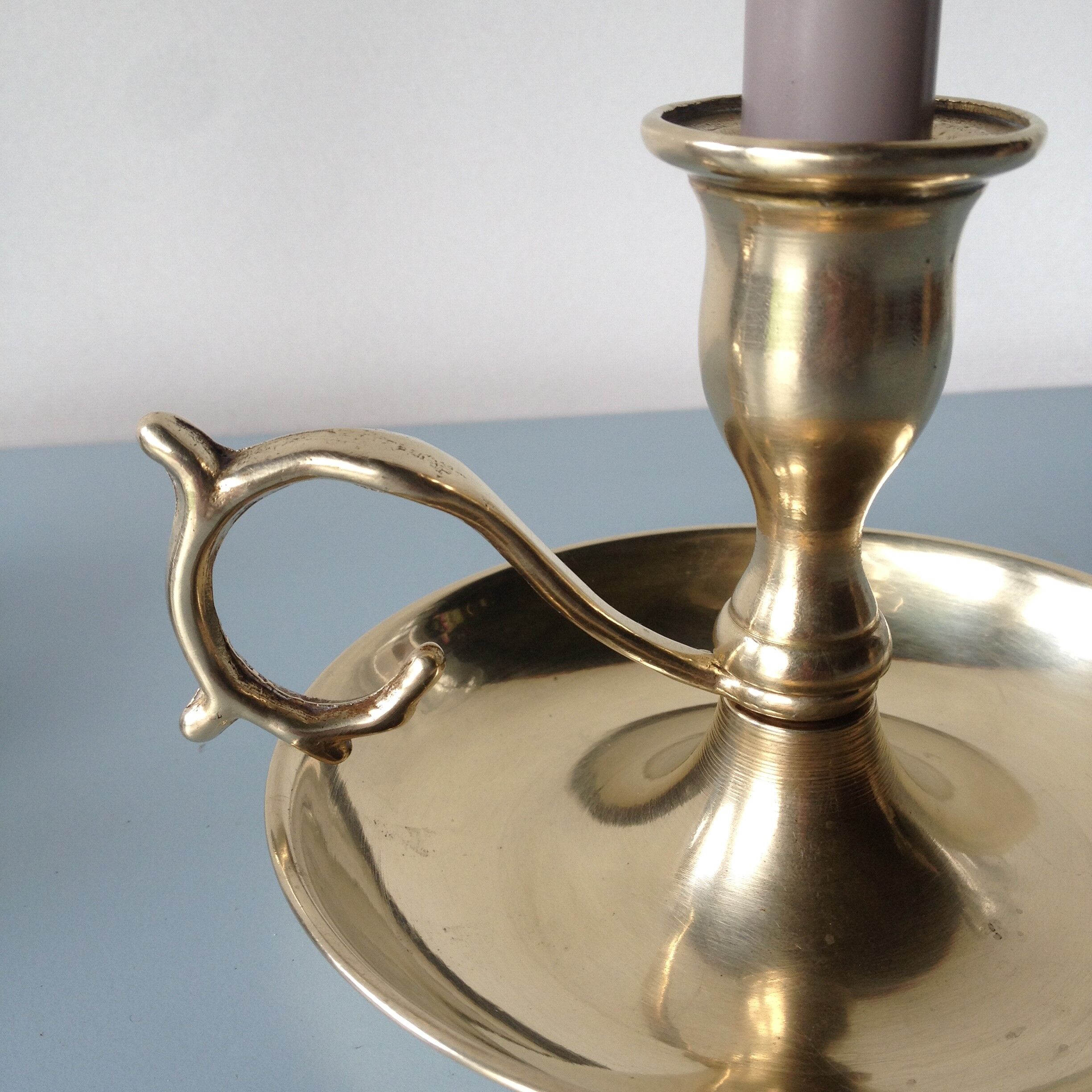 Thumb taper brass candlestick