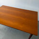 Rectangular extendable dining table with Scandinavian design in teak.