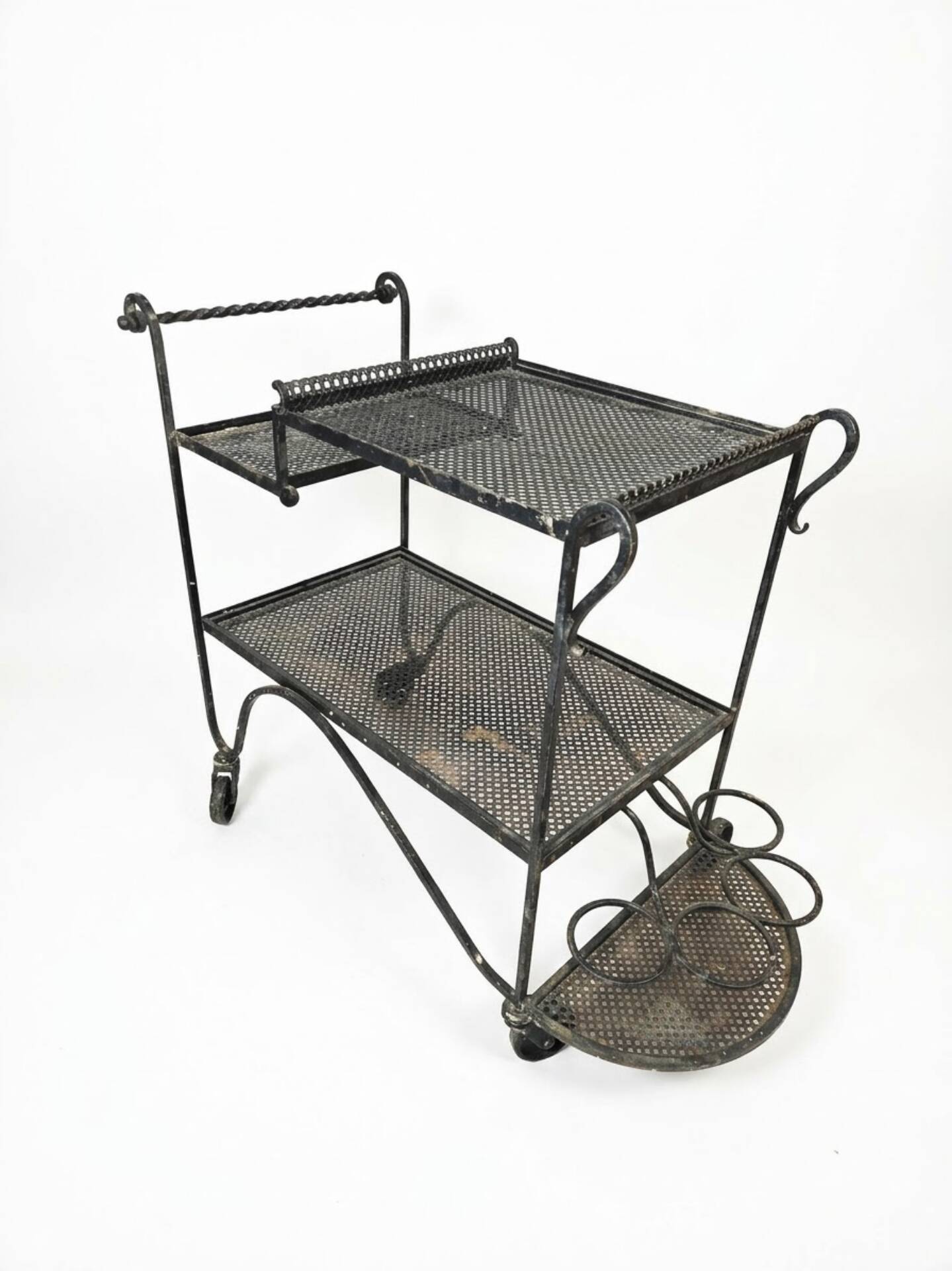Perforated wrought iron rolling dessert trolley
