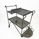 Perforated wrought iron rolling dessert trolley