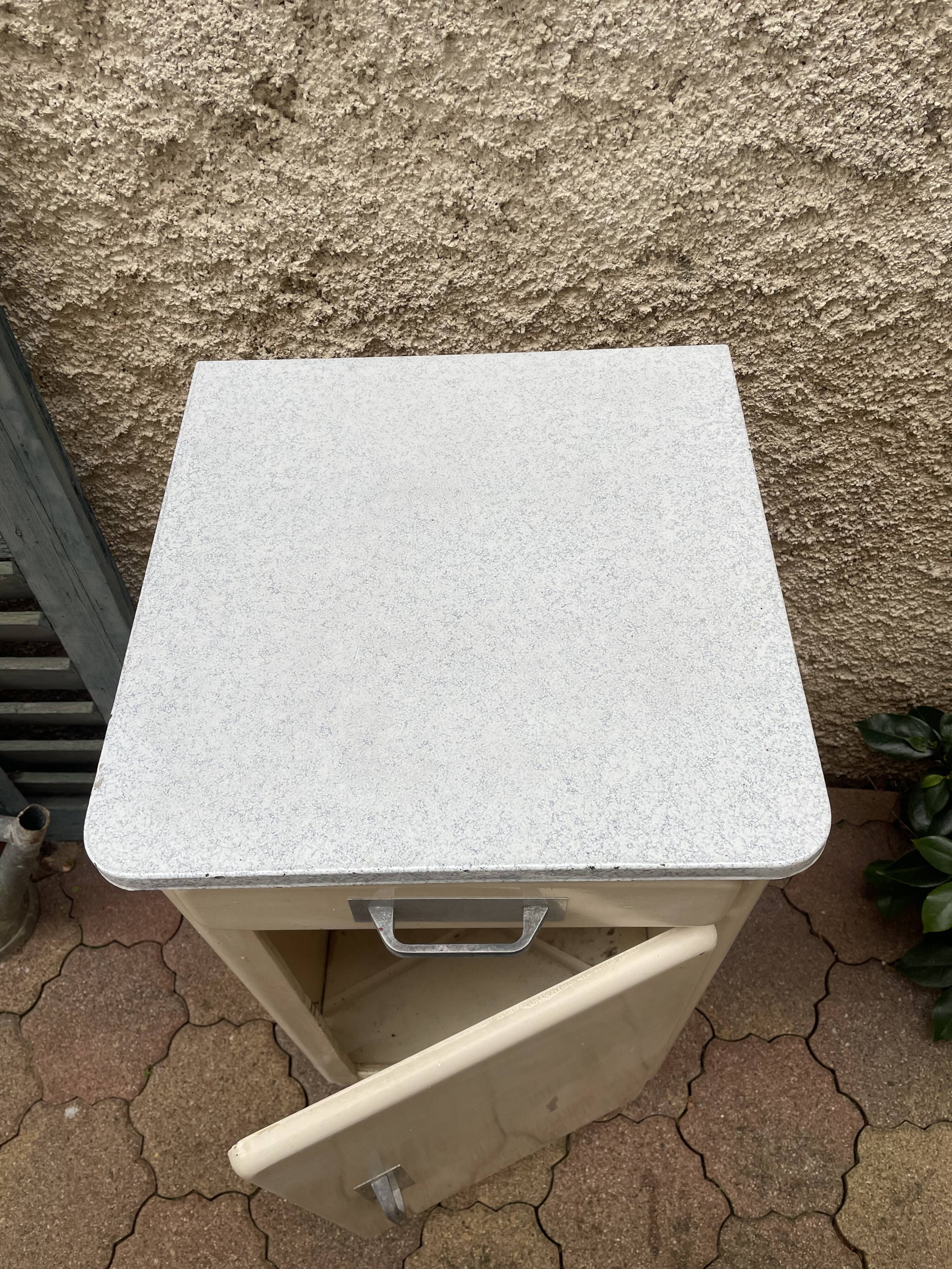 Furniture stored bottle in enamelled sheet metal