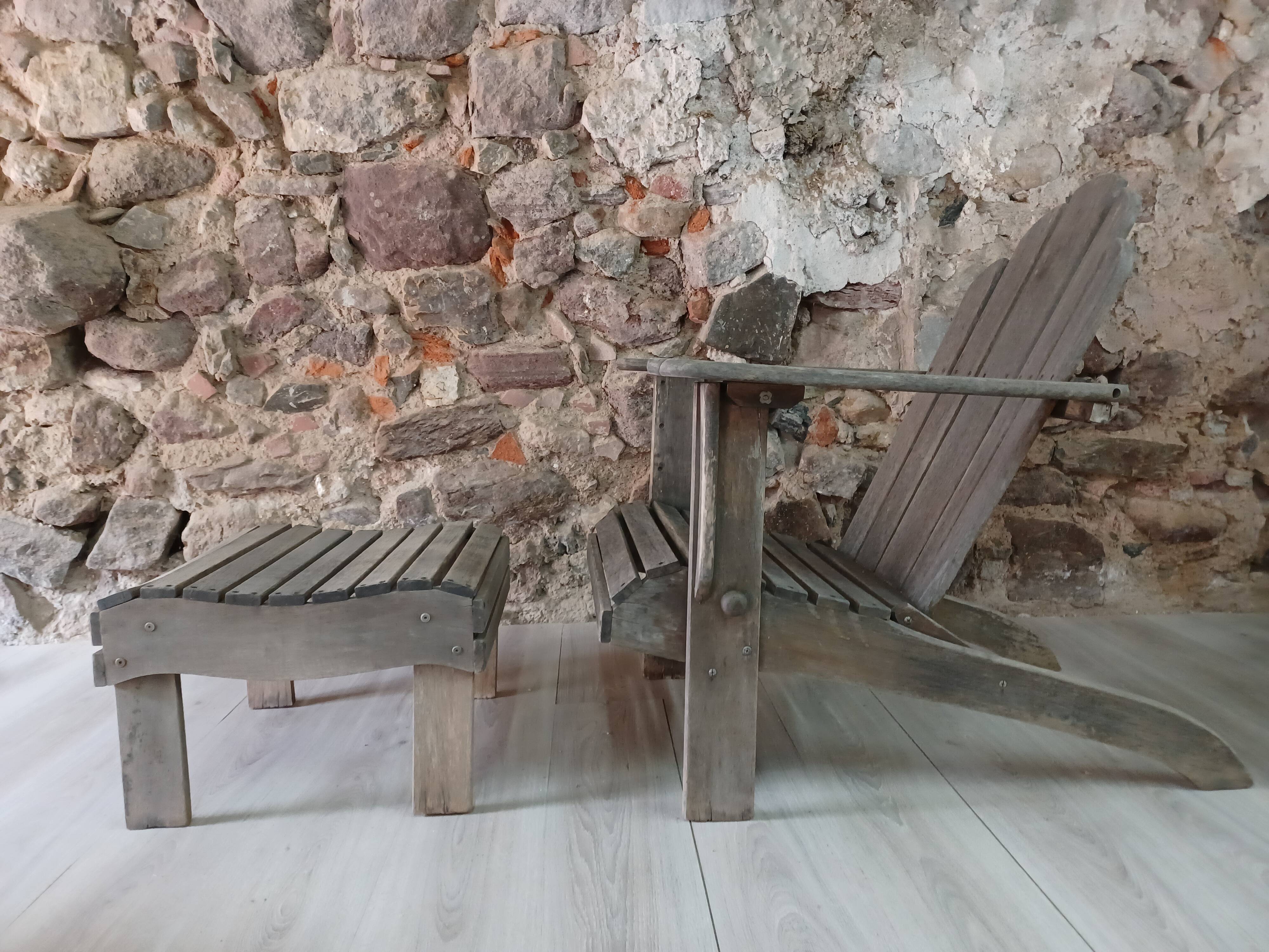 Ancient Adirondack armchair with footrest