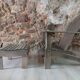 Ancient Adirondack armchair with footrest