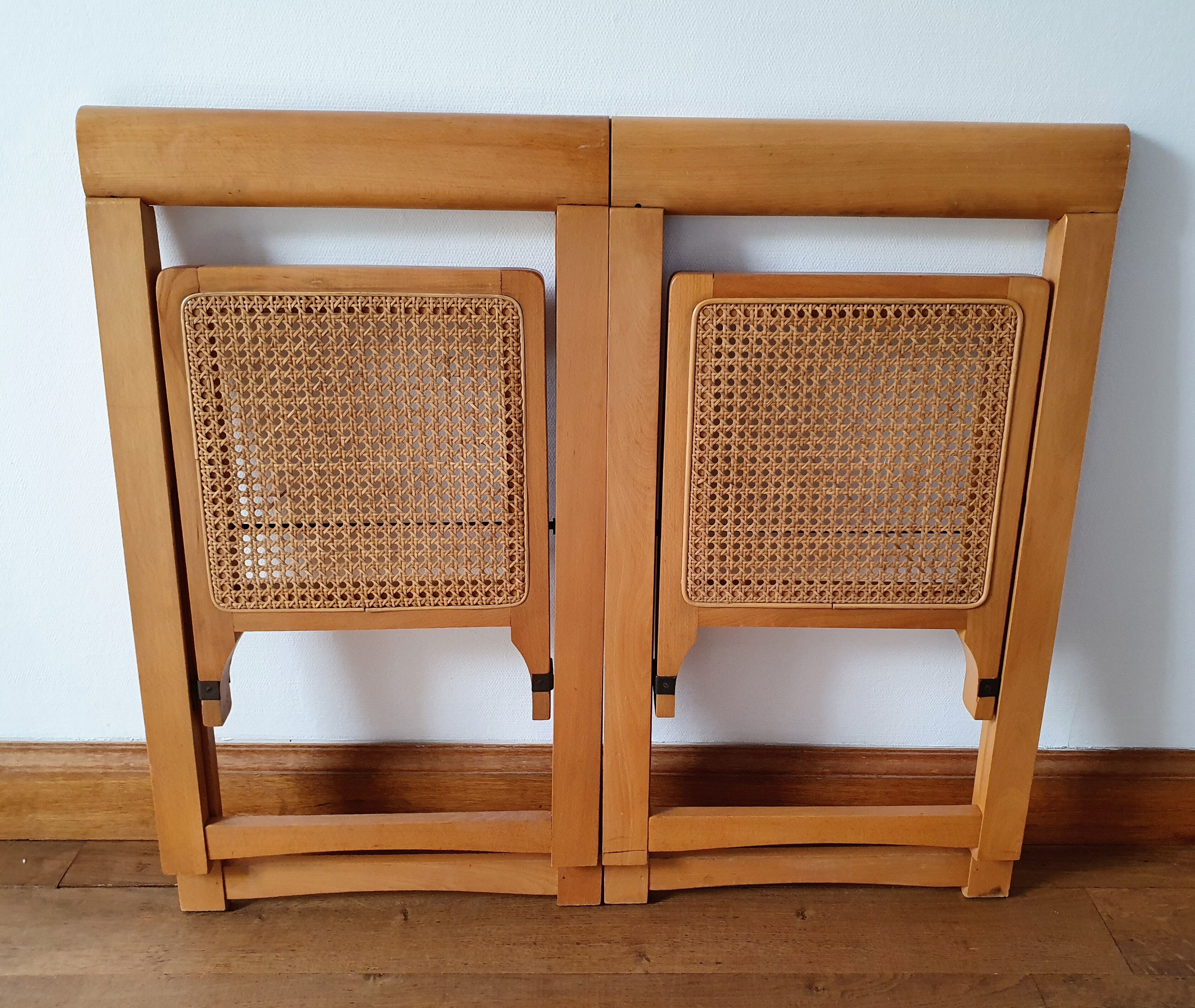 Pair of canned folding chairs.