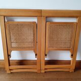 Pair of canned folding chairs.