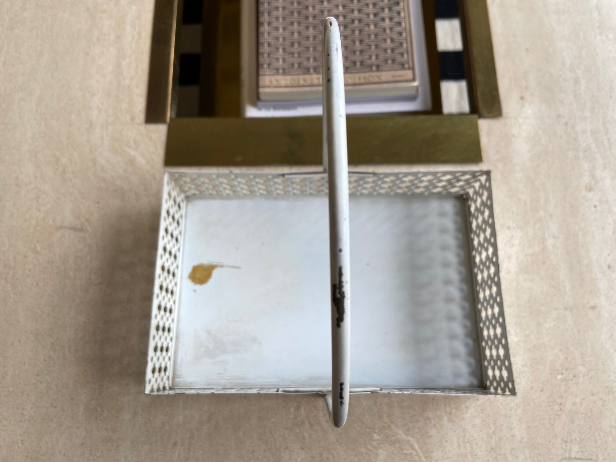 White perforated metal table basket