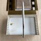 White perforated metal table basket