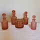 Set of 4 bottles and an art deco box in pink Bayel crystal