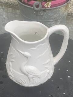 Carafe the heron in white glazed ceramic slipware.