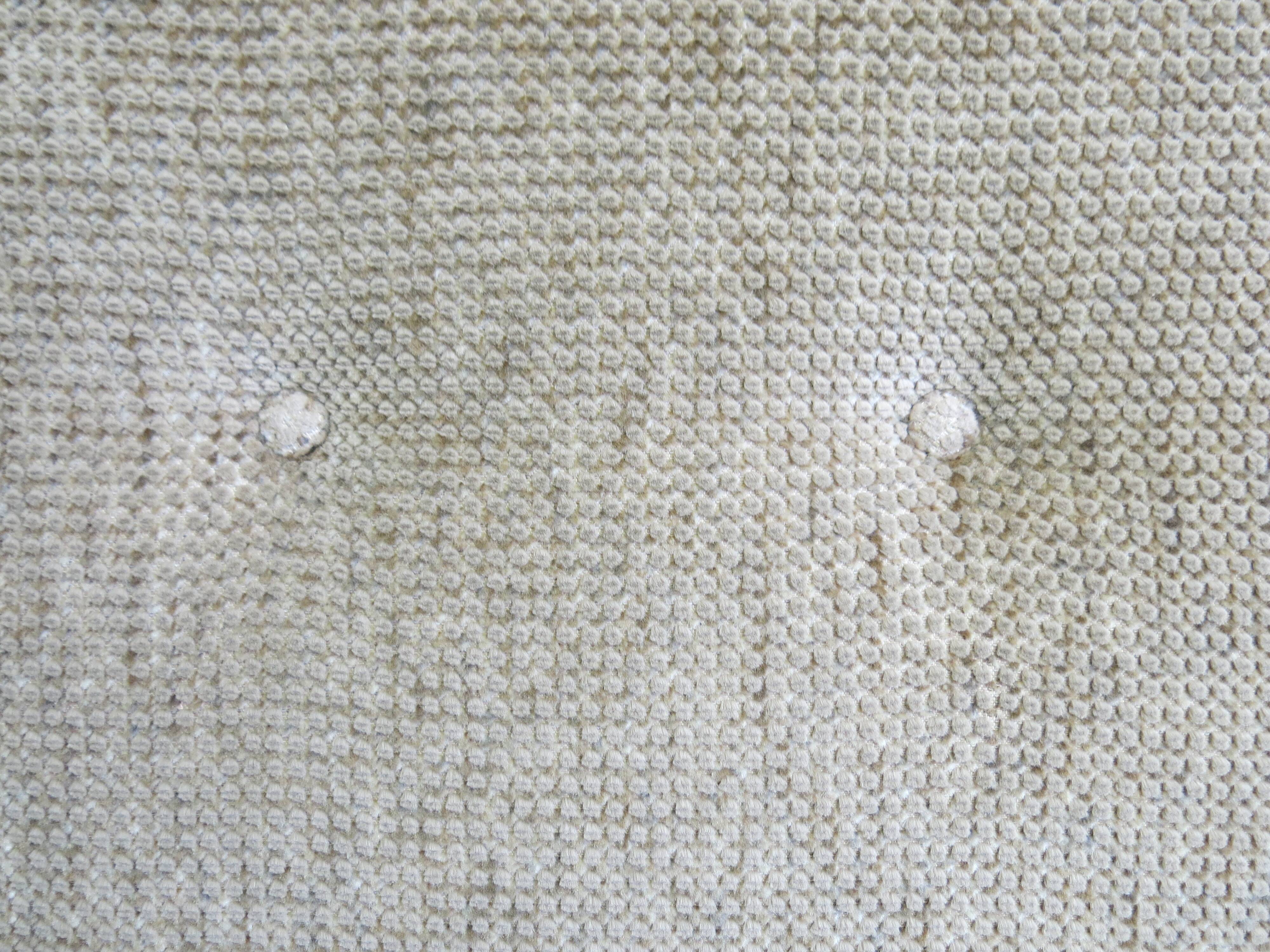 Two-seater rattan sofa with natural tones