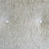 Two-seater rattan sofa with natural tones