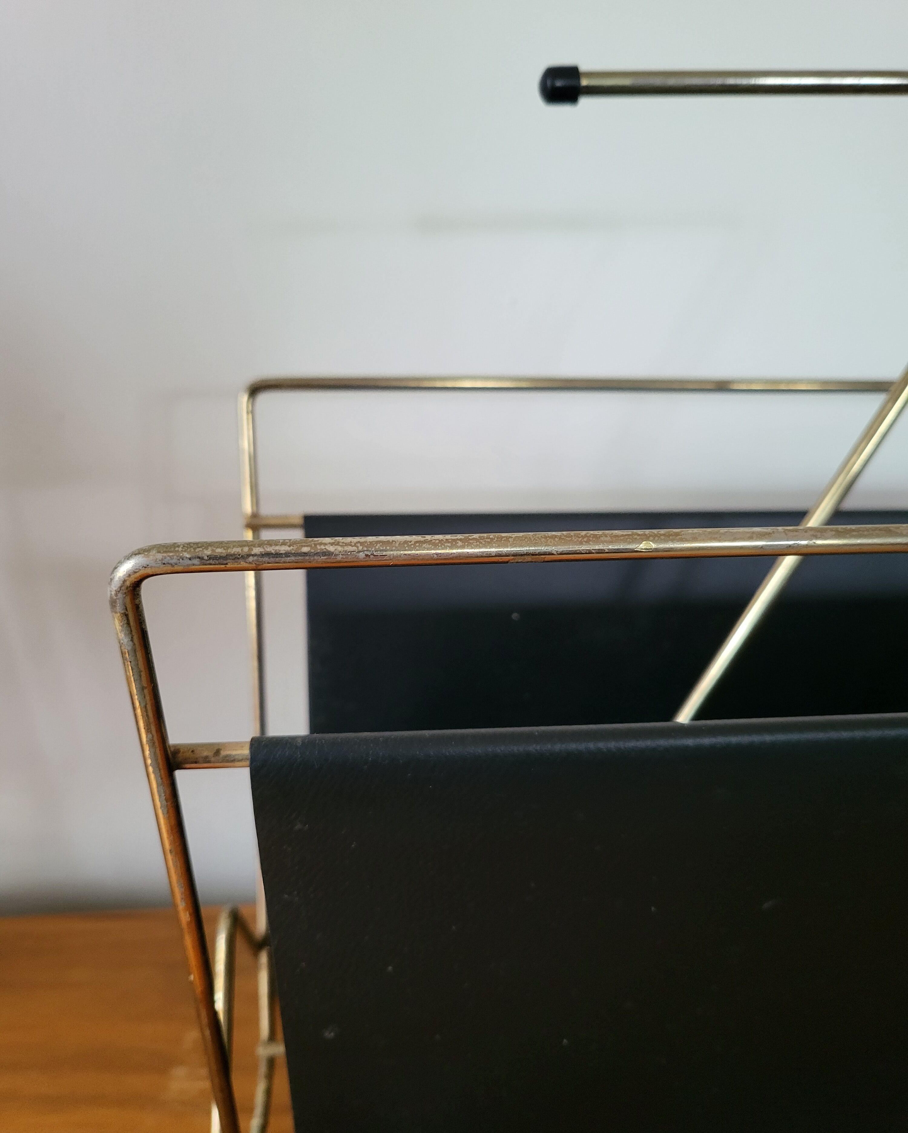 Vintage metal magazine rack in gold and black vinyl Newspaper holder