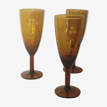 3 champagne flutes in colored glass