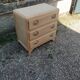 Vintage commode with tapered legs.