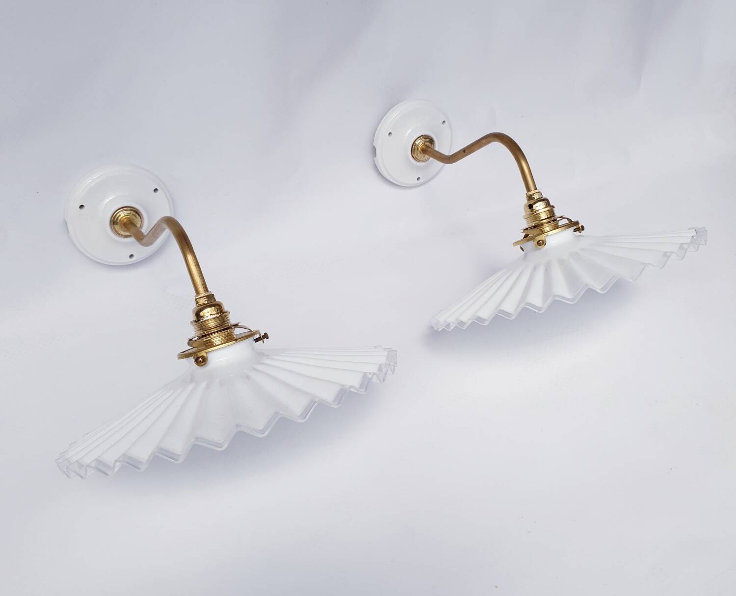 vintage wall lights in brass and pleated opal glass