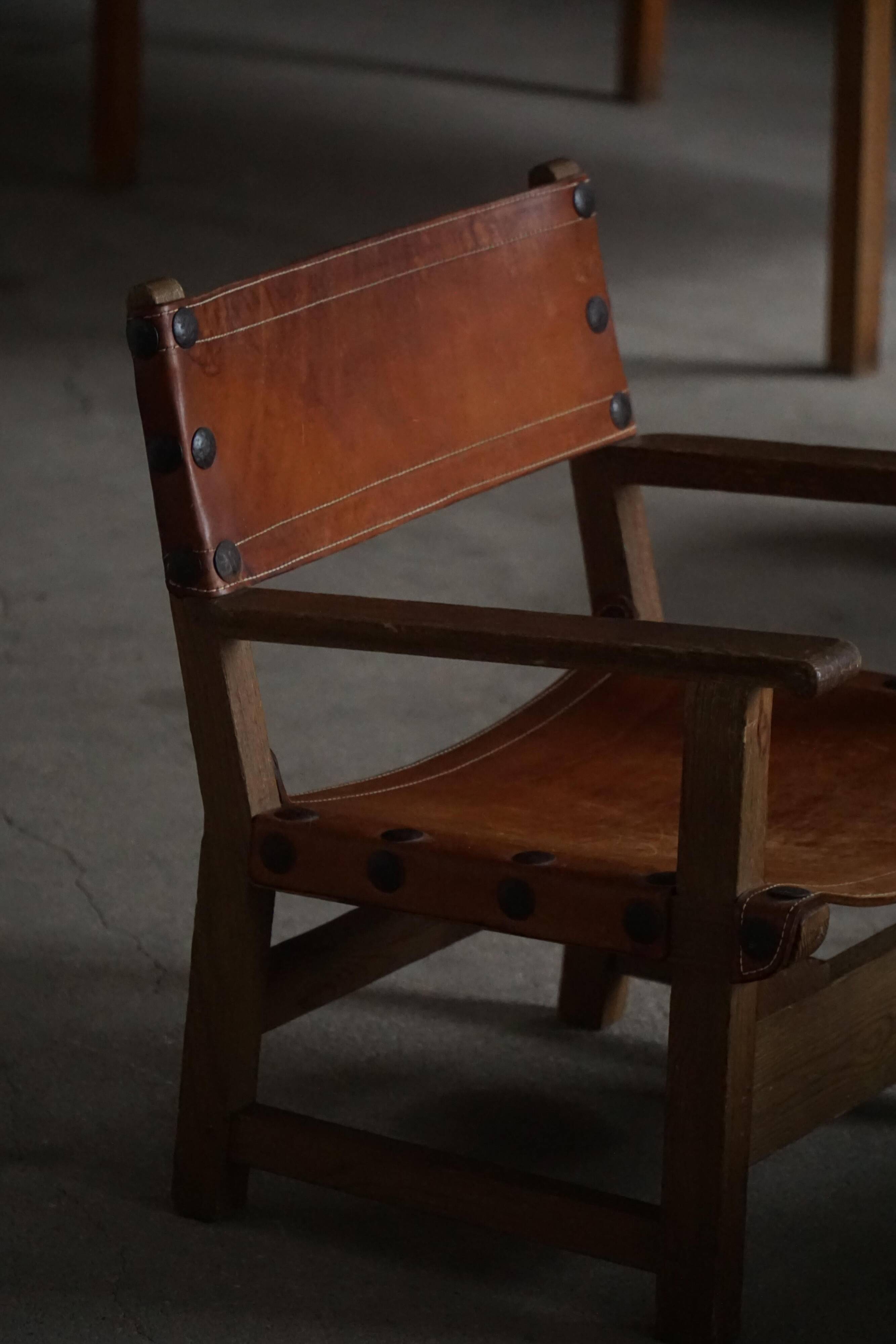 Pair of Spanish brutalist armchairs from the 1960s, wood and leather.