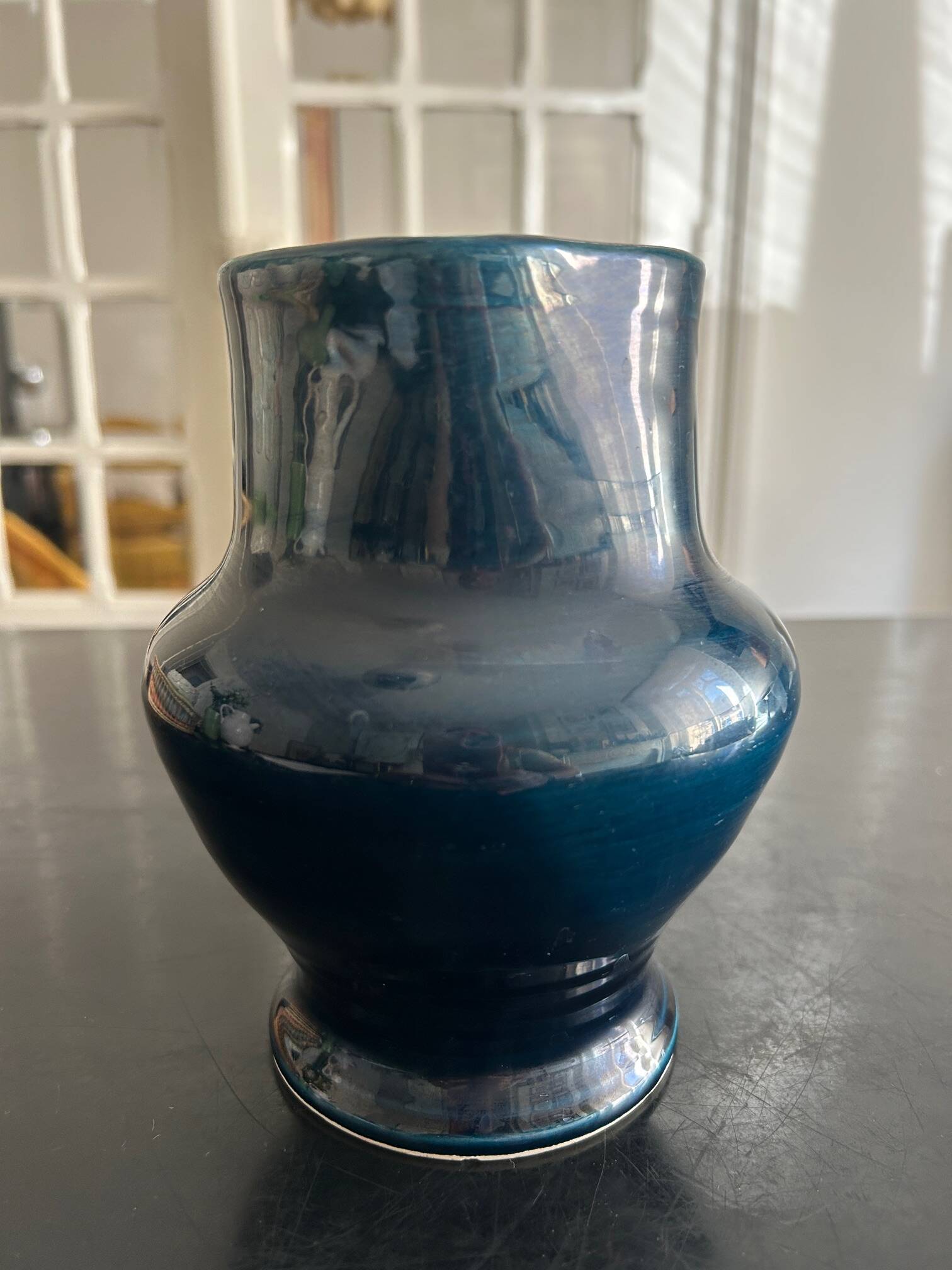 blue pitcher the potter chin